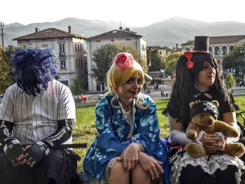 Women sitting in traditional clothing