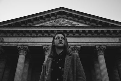 Low angle view of woman standing against kazan cathedral