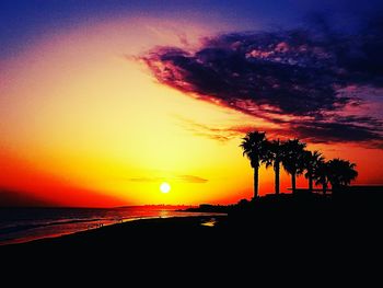 Scenic view of sea against romantic sky at sunset