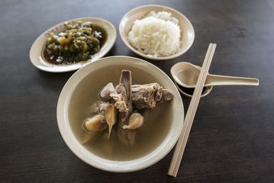 High angle view of bak kut teh in bowl on table