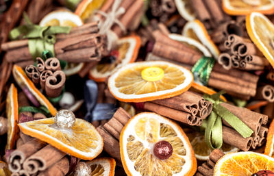 Christmas background of dried fruits and spices, dried lemon, anise stars and cinnamon sticks