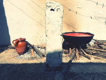 High angle view of container and wood against wall