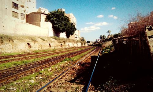 View of railway tracks along buildings