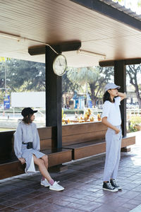 Side view of young couple standing on floor