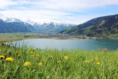 Scenic view of sea and mountains against sky