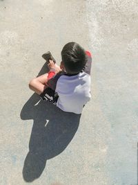 High angle view of woman using mobile phone