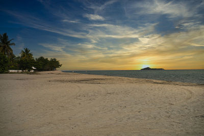 Scenic view of beach against sky during sunset, panama