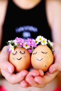 Midsection of woman holding easter egg