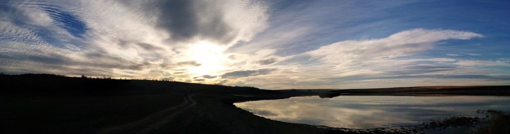 Scenic view of landscape against sky during sunset