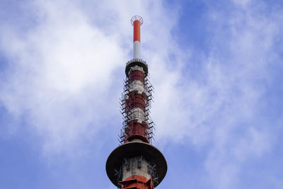 Low angle view of communications tower against sky