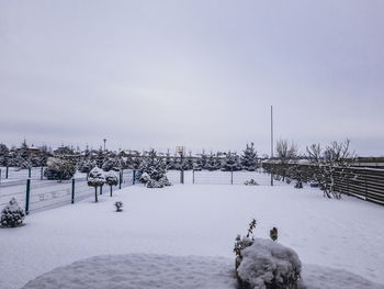 Scenic view of snow covered landscape against clear sky