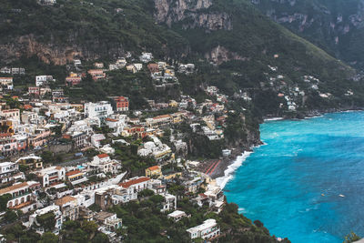 High angle view of townscape by sea