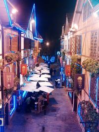 Illuminated walkway at night