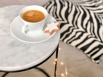 High angle view of coffee cup on table