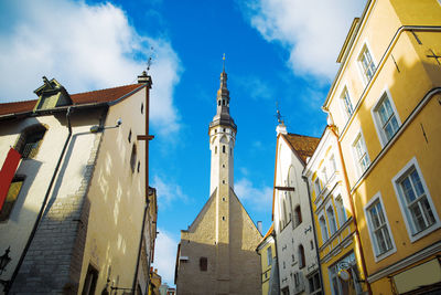 Low angle view of buildings against sky in city