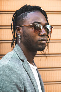 Portrait of young man wearing sunglasses