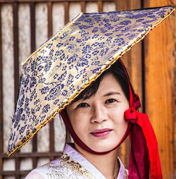 Portrait of a smiling young woman in rain