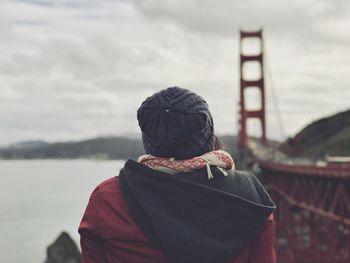 Rear view of a woman by bridge