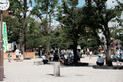 People walking on street in park