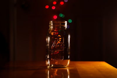 Close-up of glass jar on table