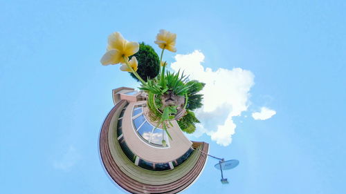 Low angle view of statue against blue sky
