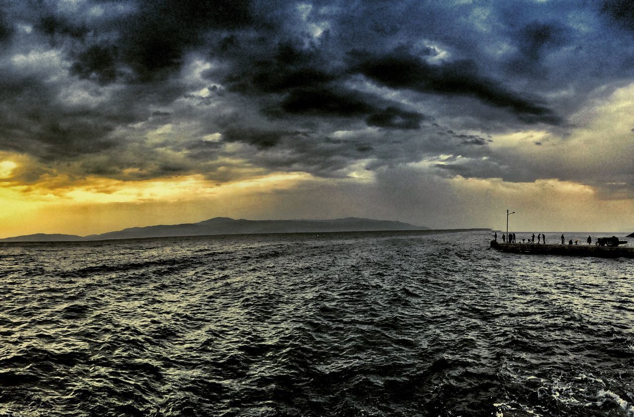 sea, sky, sunset, water, cloud - sky, horizon over water, scenics, beauty in nature, tranquil scene, tranquility, cloudy, nature, cloud, nautical vessel, transportation, idyllic, dramatic sky, mode of transport, boat, orange color