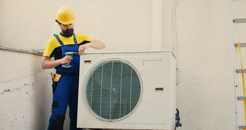 Rear view of man working at home