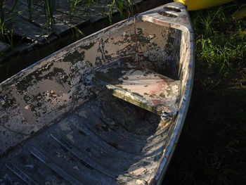 High angle view of old abandoned car on field