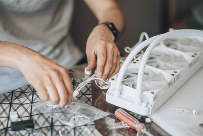 Person engaged in assembling or working on computer hardware, involving precise technical work 