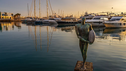 Boats moored at harbor