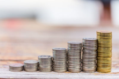 Close-up of coin stack on table