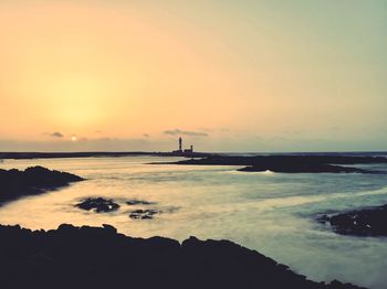 Scenic view of sea against sky during sunset