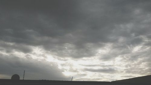 Low angle view of building against cloudy sky