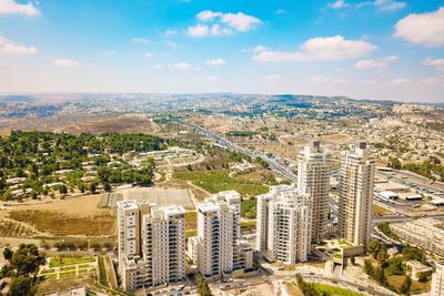 High angle view of buildings in city against sky