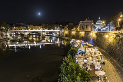High angle view of illuminated bridge over river at night