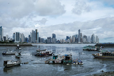 View of the panama city skyline during day and at low tide. 