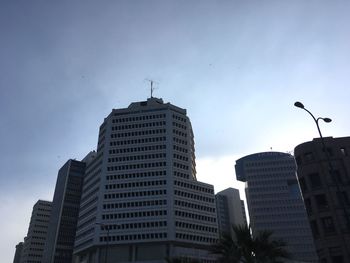 Low angle view of skyscrapers against sky