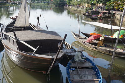 Boats moored at lakeshore