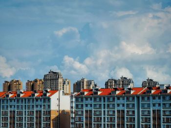 Buildings in city against sky