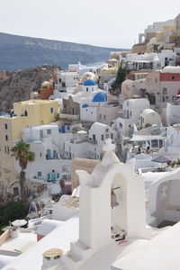 Houses in town against sky