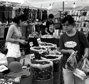 Rear view of girl sitting on table