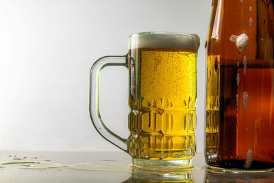 Close-up of beer glass on table