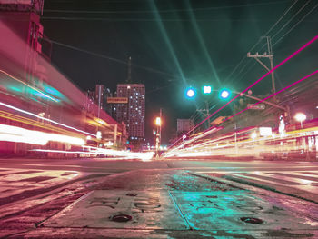 Light trails on city street at night