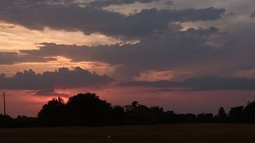 Scenic view of landscape against cloudy sky