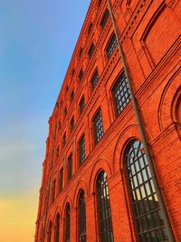 Low angle view of red building against sky