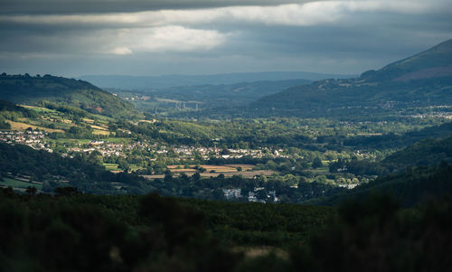 Landscape and mountains against sky