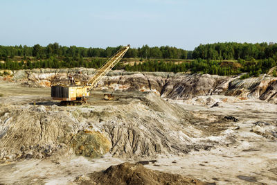 Old quarry for the extraction of clay with excavator.