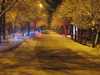 View of illuminated street at night