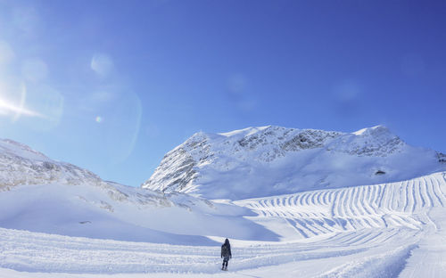 Full length of a person standing on snow covered landscape