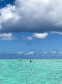 Scenic view of sea against cloudy sky